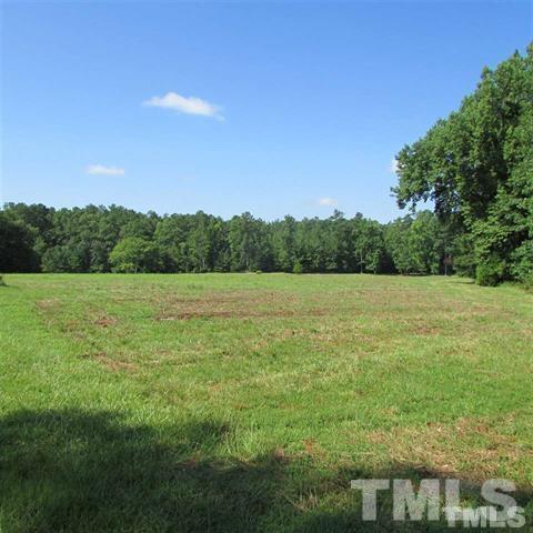 1625 Pearces Road Zebulon, NC 27597 - Photo 1 of 6 a view of a field with an ocean view