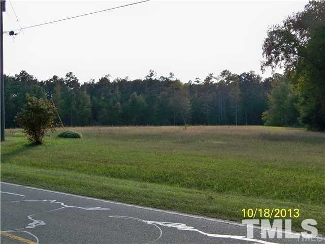 1625 Pearces Road Zebulon, NC 27597 - Photo 5 of 6 a view of a grassy field