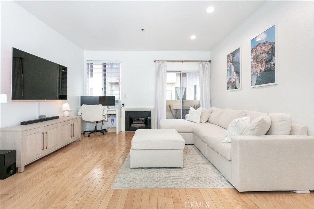 19350 Sherman Way, Unit 124 Reseda, CA 91335 - Photo 11 of 26 a living room with furniture and a flat screen tv