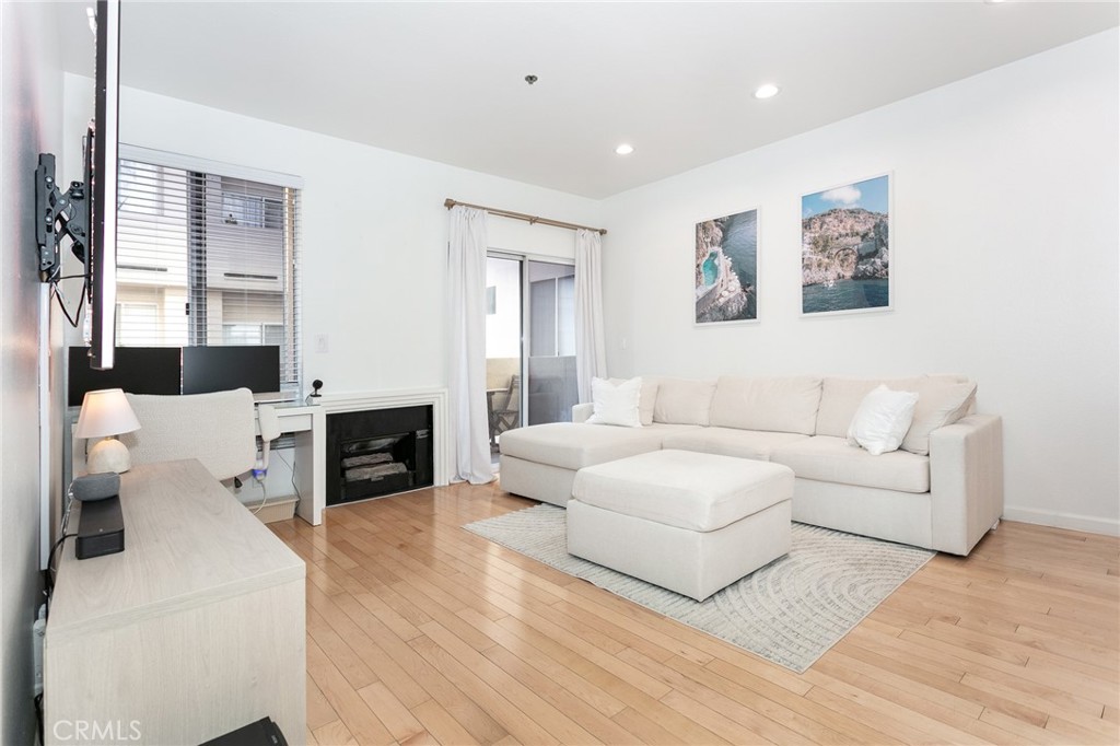 19350 Sherman Way, Unit 124 Reseda, CA 91335 - Photo 12 of 26 a living room with furniture and a fireplace
