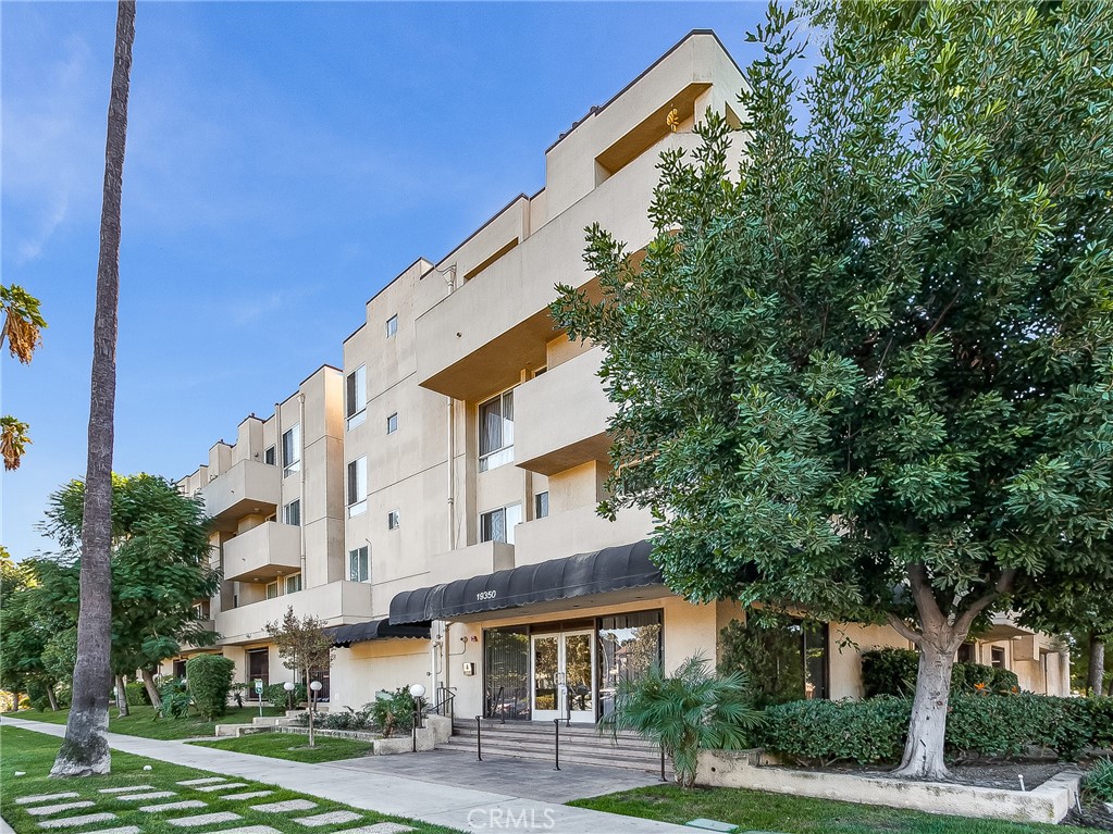 19350 Sherman Way, Unit 124 Reseda, CA 91335 - Photo 2 of 26 a view of a building with a street