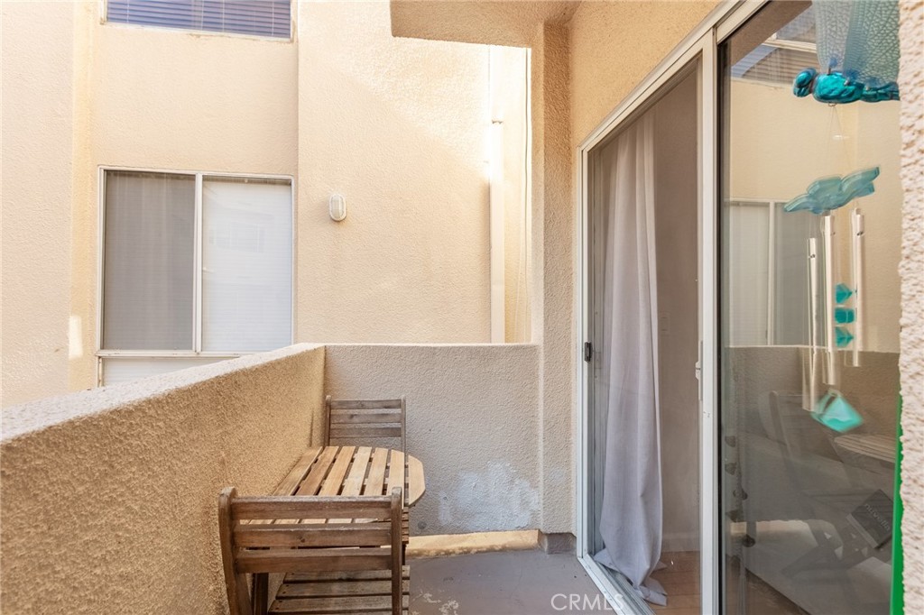 19350 Sherman Way, Unit 124 Reseda, CA 91335 - Photo 21 of 26 a view of front door with chair