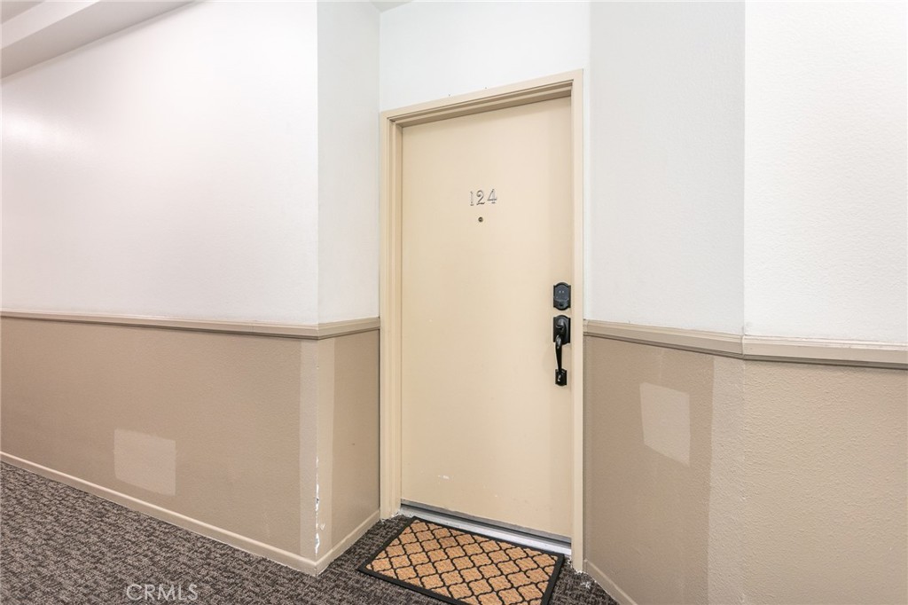 19350 Sherman Way, Unit 124 Reseda, CA 91335 - Photo 4 of 26 a view of walk in closet with empty racks
