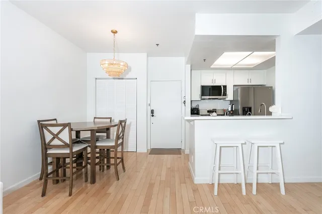 a view of kitchen with cabinets and wooden floor