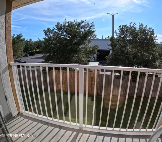 a view of a wooden fence