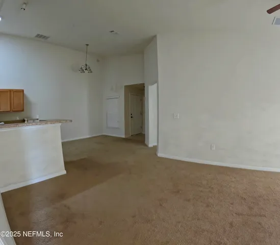 a view of a room with a hallway