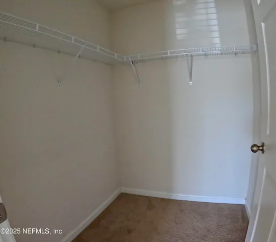 a view of a room with racks on the wall