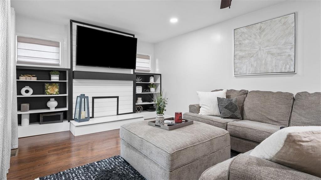 Living Room  with Beautiful Hardwood Floors and Custom Built-ins!
