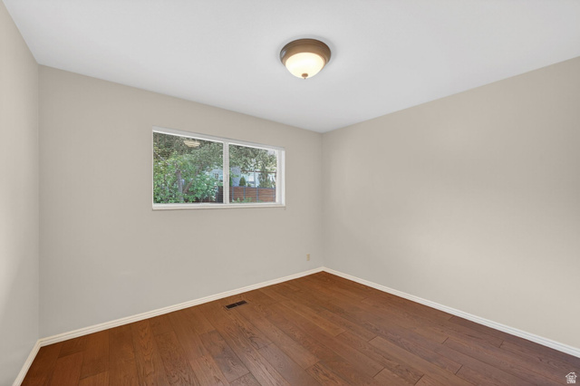 3120 North Apache Way Provo, UT 84604 - Photo 35 of 58 Room featuring wood-finish flooring, neutral wall tones, and white baseboards
