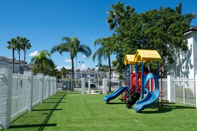 a view of yard with swimming pool and outdoor seating