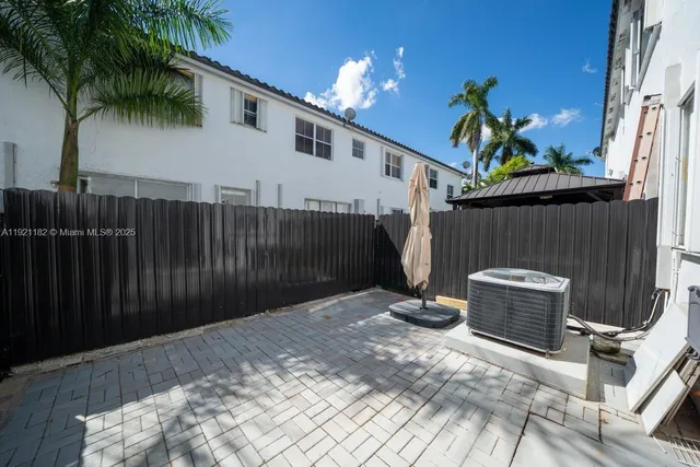 a view of a park with swings and slides