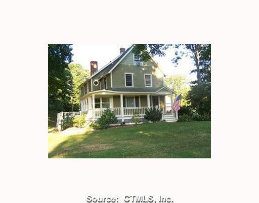 712 Racebrook Road Orange, CT 06477 - Photo 1 of 1 a front view of a house with a yard