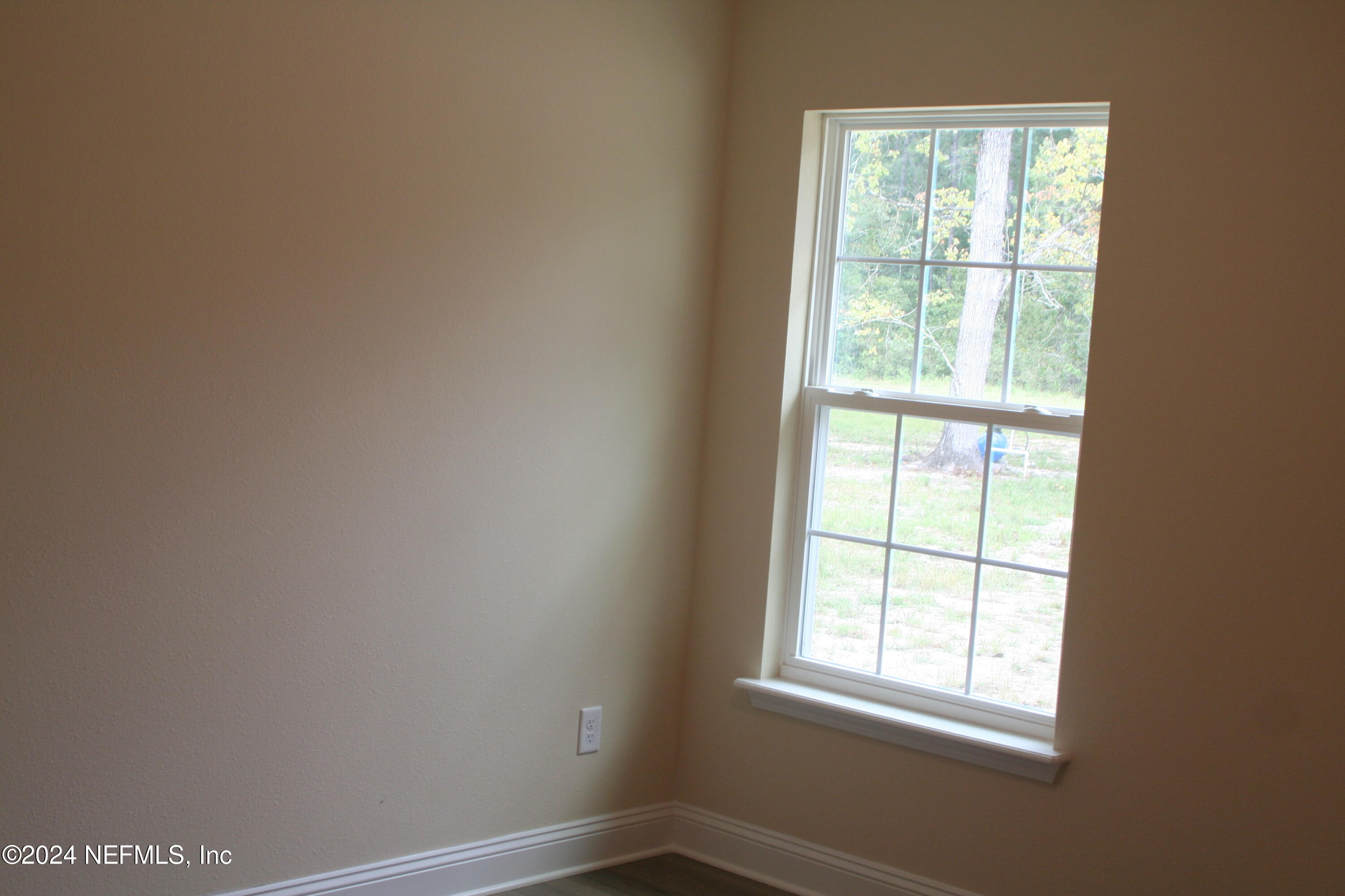 54516 Church Road Callahan, FL 32011 - Photo 16 of 39 an empty room with a window