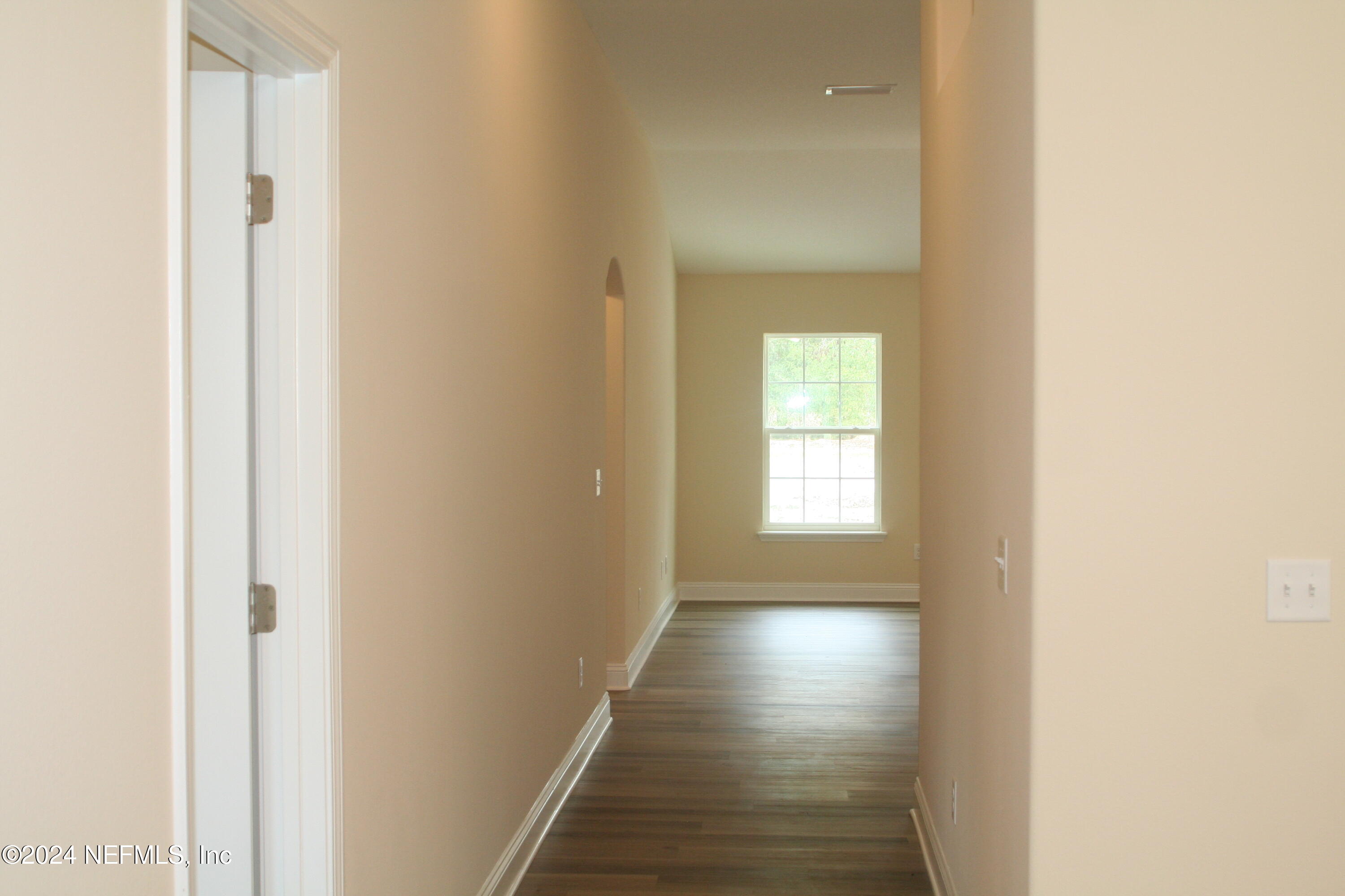 54516 Church Road Callahan, FL 32011 - Photo 5 of 39 a view of a hallway with wooden floor