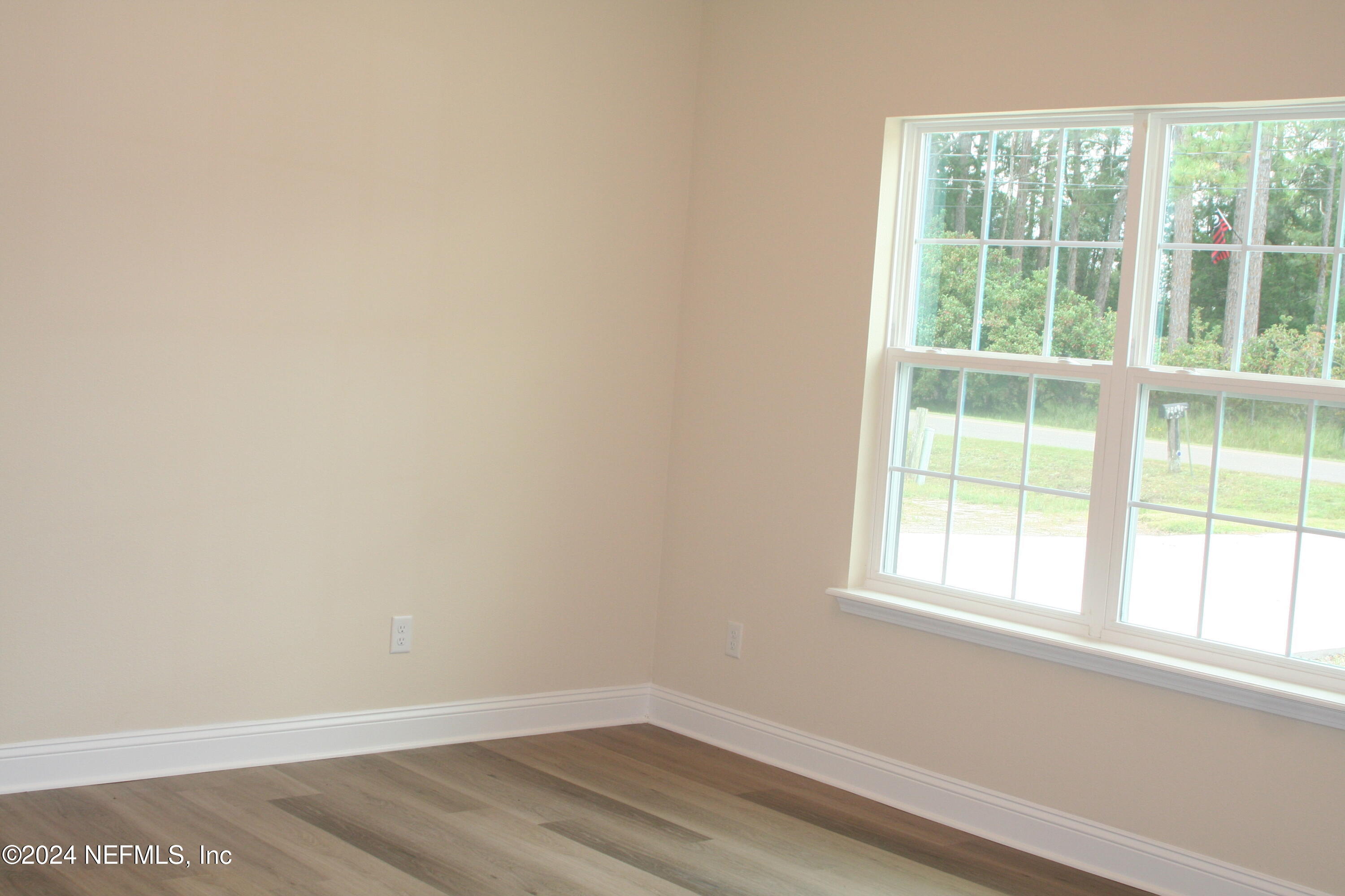54516 Church Road Callahan, FL 32011 - Photo 6 of 39 an empty room with a window