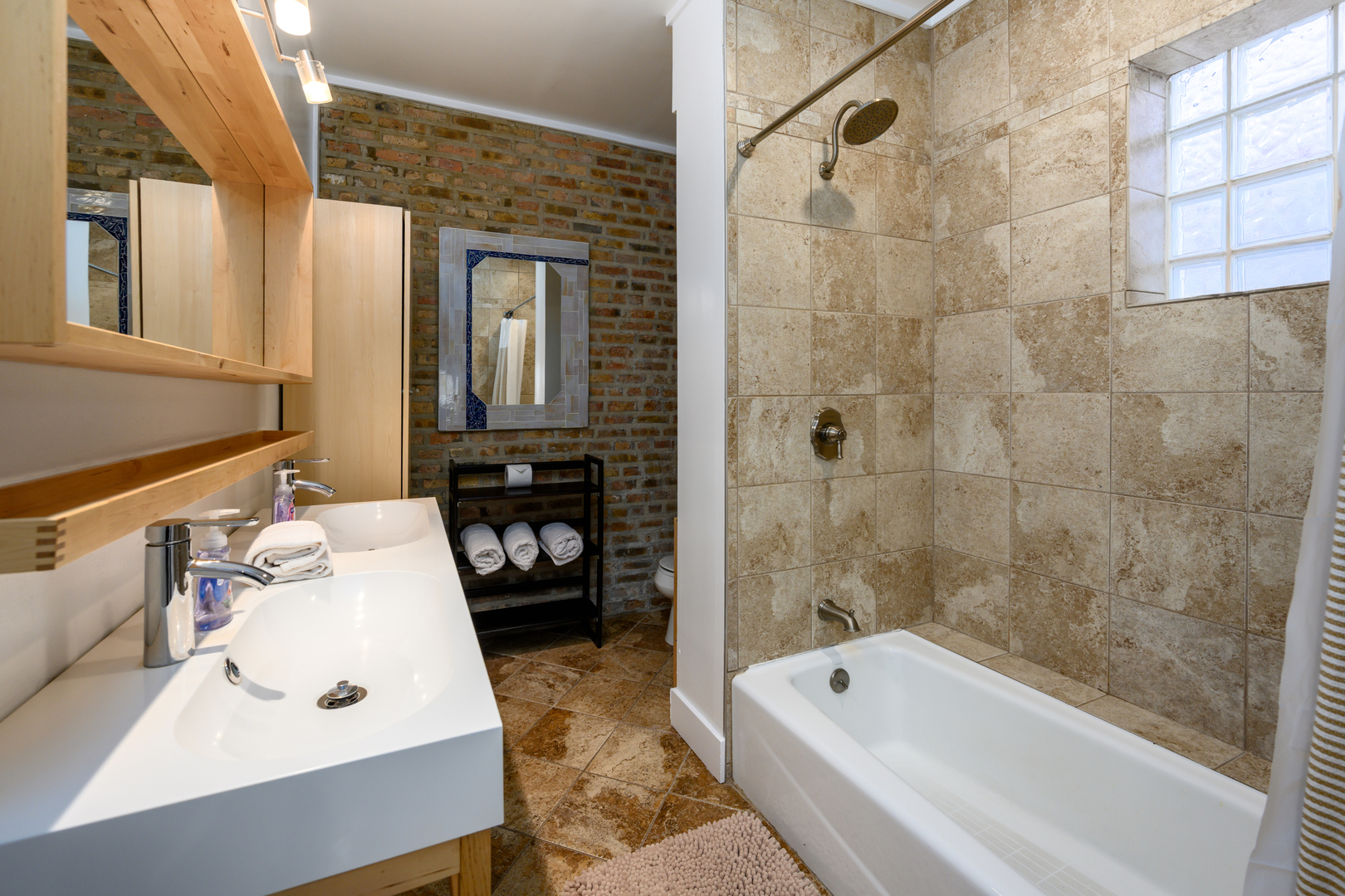 1646 West Blackhawk Street Chicago, IL 60622 - Photo 12 of 21 a bathroom with a tub sink and mirror