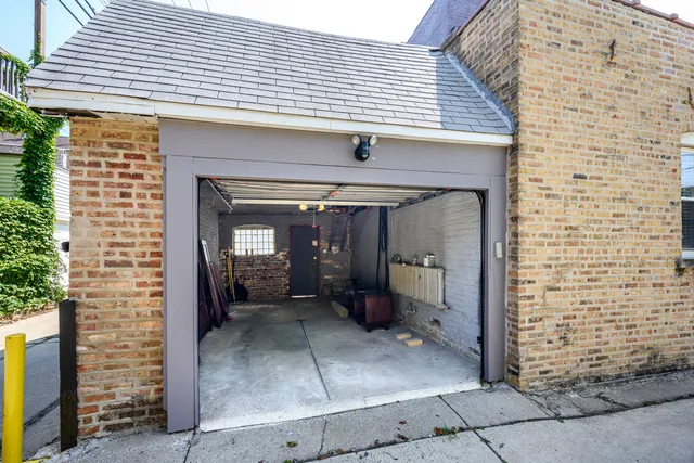 a view of a brick house with a large window
