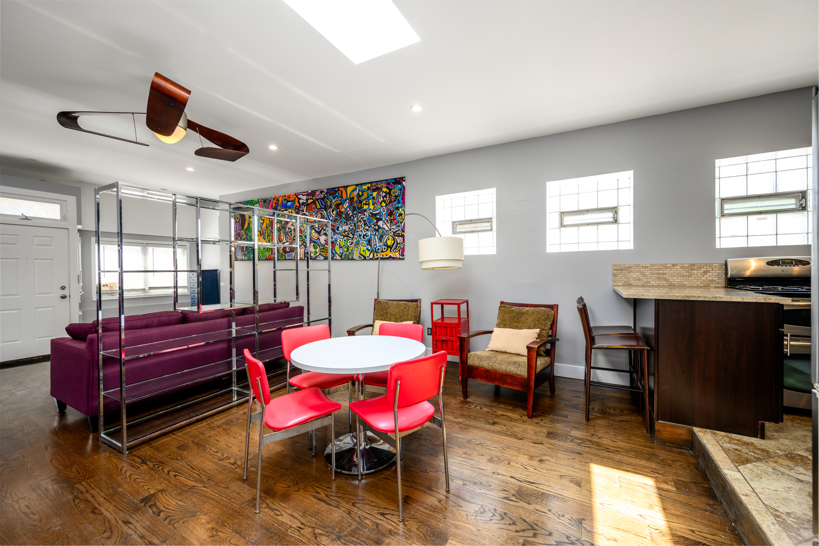 1646 West Blackhawk Street Chicago, IL 60622 - Photo 3 of 21 a living room with furniture a ceiling fan and a window