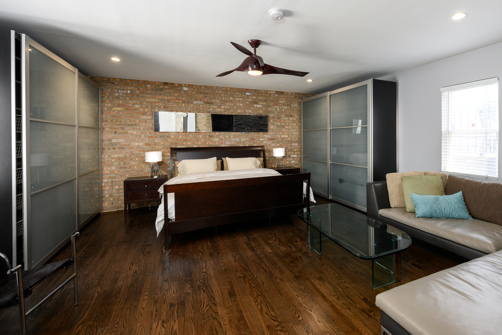 1646 West Blackhawk Street Chicago, IL 60622 - Photo 8 of 21 a bedroom with a bed and wooden floor