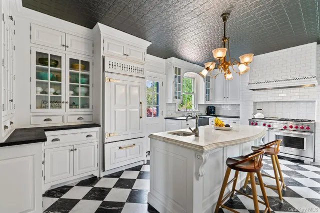 a kitchen that has a cabinets and a stove