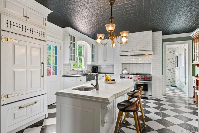 a kitchen that has a lot of cabinets and refrigerator