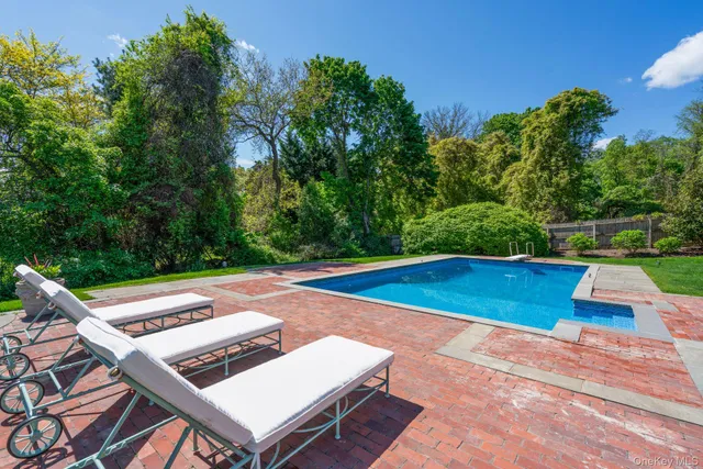 a view of a patio with swimming pool
