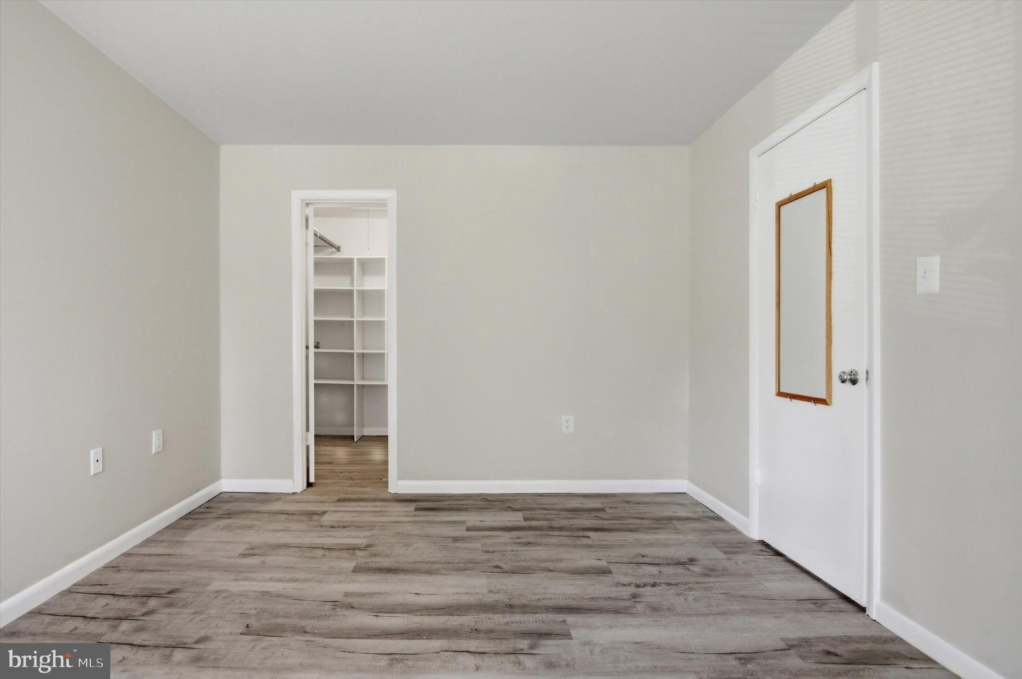 10340 Luria Commons Court, Unit 3H Burke, VA 22015 - Photo 14 of 21 wooden floor in an empty room