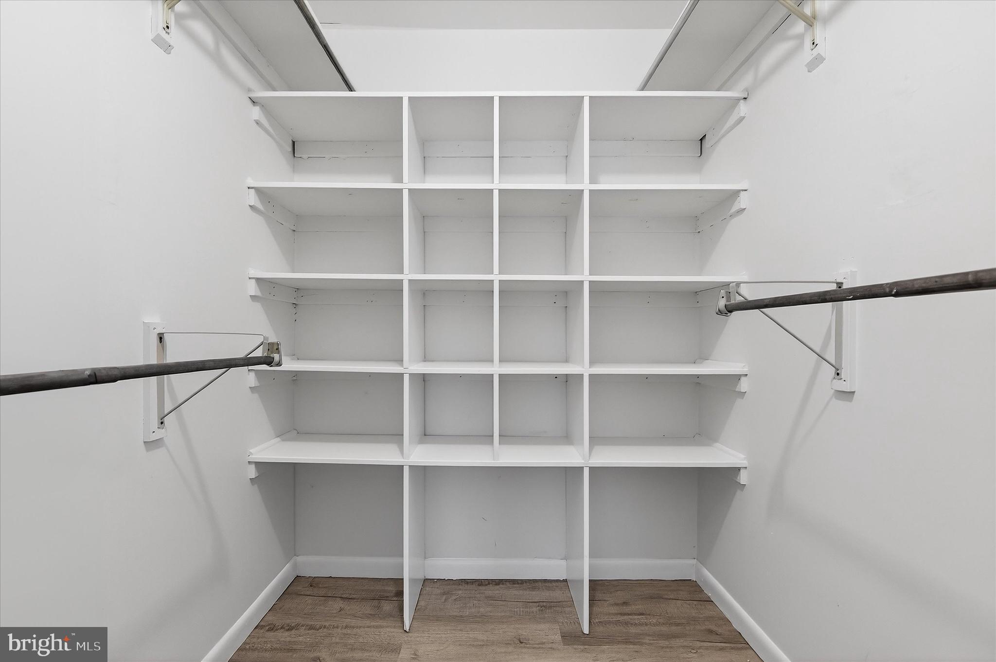 10340 Luria Commons Court, Unit 3H Burke, VA 22015 - Photo 15 of 21 a view of walk in closet with empty racks