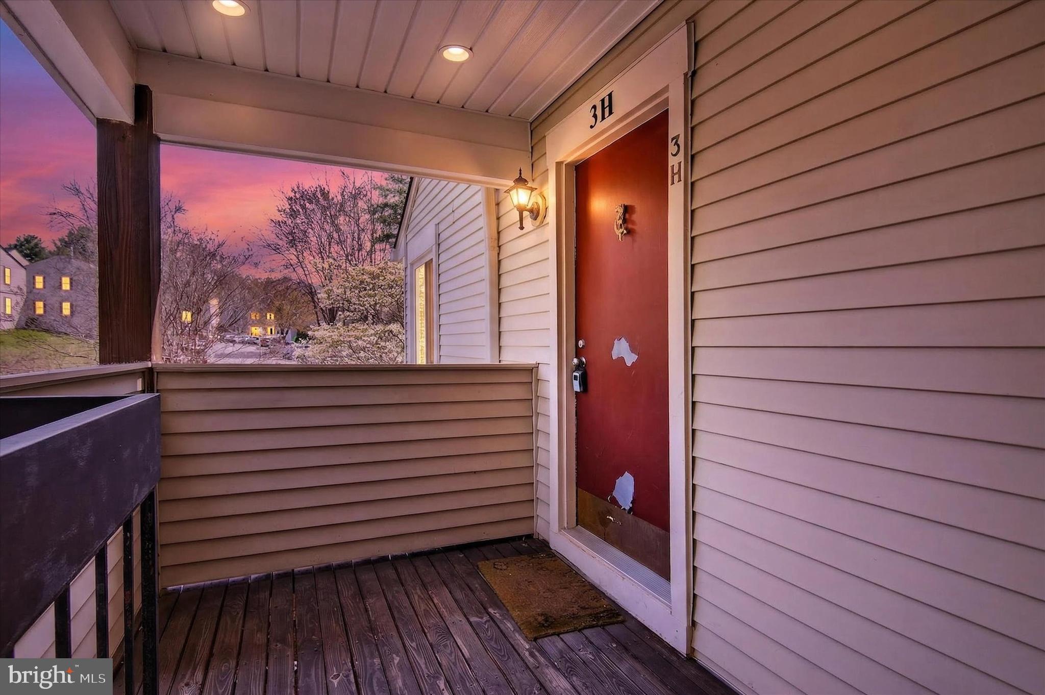 10340 Luria Commons Court, Unit 3H Burke, VA 22015 - Photo 19 of 21 a view of a balcony with wooden floor