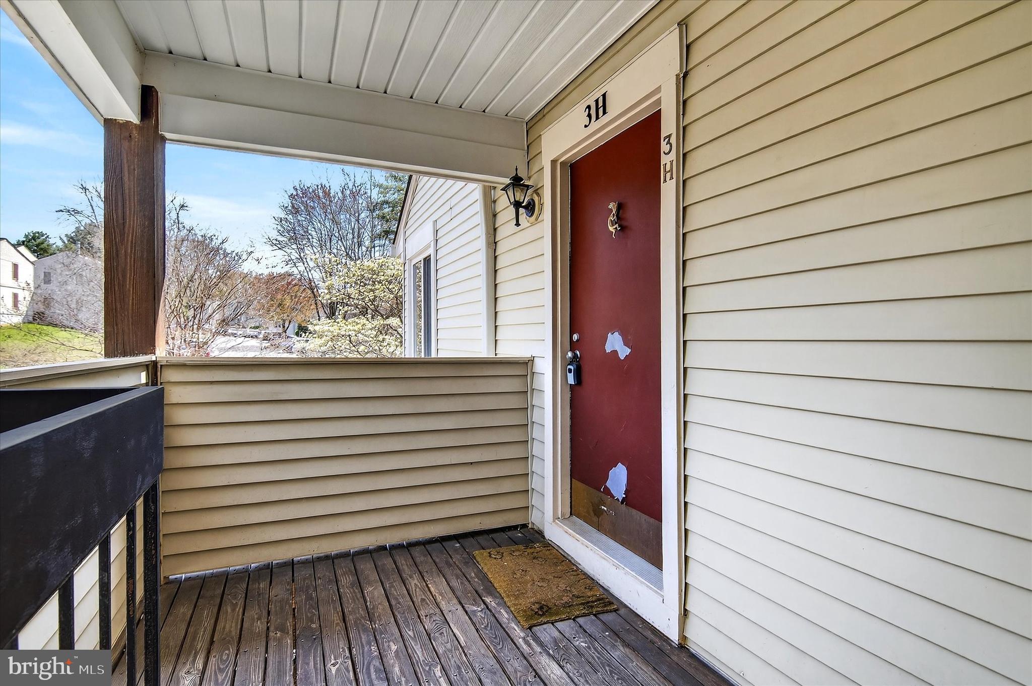 10340 Luria Commons Court, Unit 3H Burke, VA 22015 - Photo 20 of 21 a view of a porch with wooden floor