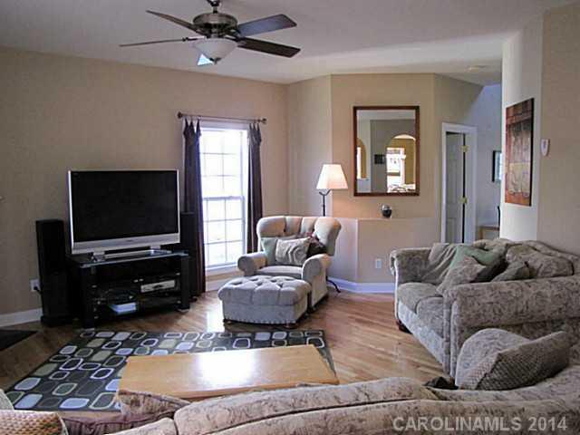 14112 Wild Elm Road Charlotte, NC 28277 - Photo 2 of 16 a living room with furniture and a flat screen tv