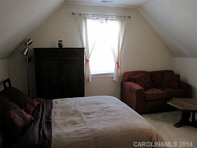 14112 Wild Elm Road Charlotte, NC 28277 - Photo 12 of 16 a bedroom with a bed and window
