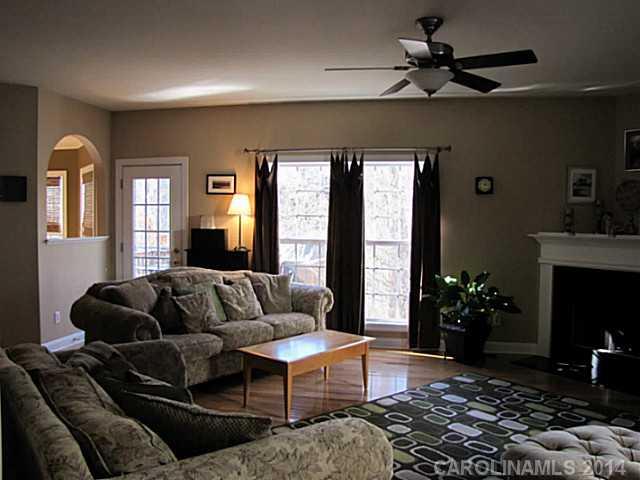 14112 Wild Elm Road Charlotte, NC 28277 - Photo 3 of 16 a living room with furniture fireplace and flat screen tv
