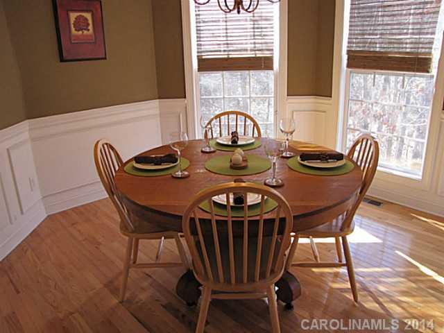 14112 Wild Elm Road Charlotte, NC 28277 - Photo 4 of 16 a view of a dining room with furniture window and outside view