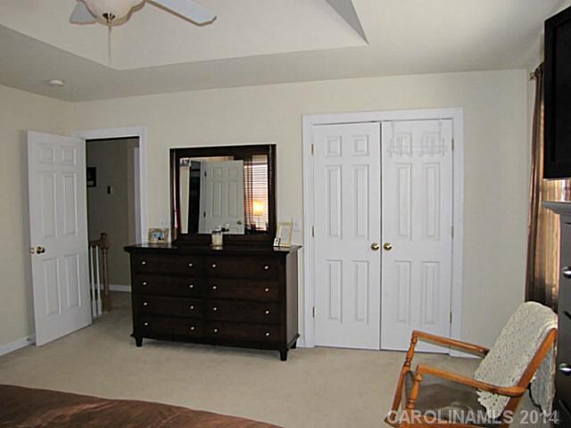 14112 Wild Elm Road Charlotte, NC 28277 - Photo 9 of 16 a room with a dresser and a window