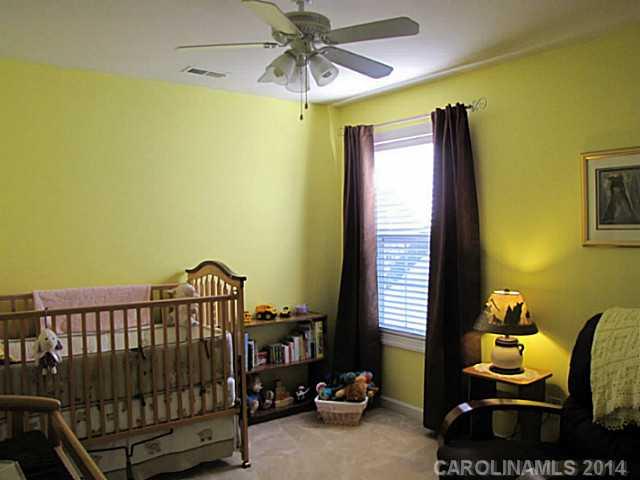 14112 Wild Elm Road Charlotte, NC 28277 - Photo 10 of 16 a view of a bedroom with furniture and a window