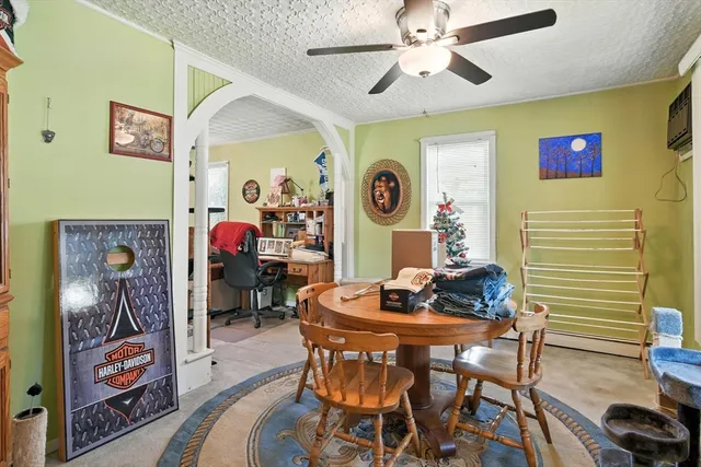 a dining room with furniture and window