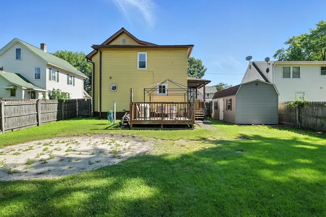 a balcony with wooden floor outdoor seating and nature