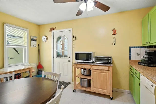 a kitchen with stainless steel appliances granite countertop a stove and a microwave with cabinets
