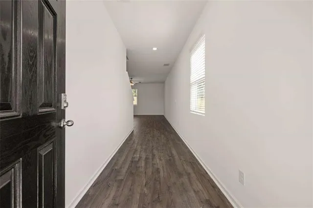 a kitchen with a sink appliances and cabinets