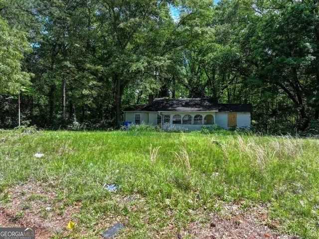 a backyard of a house with lots of green space
