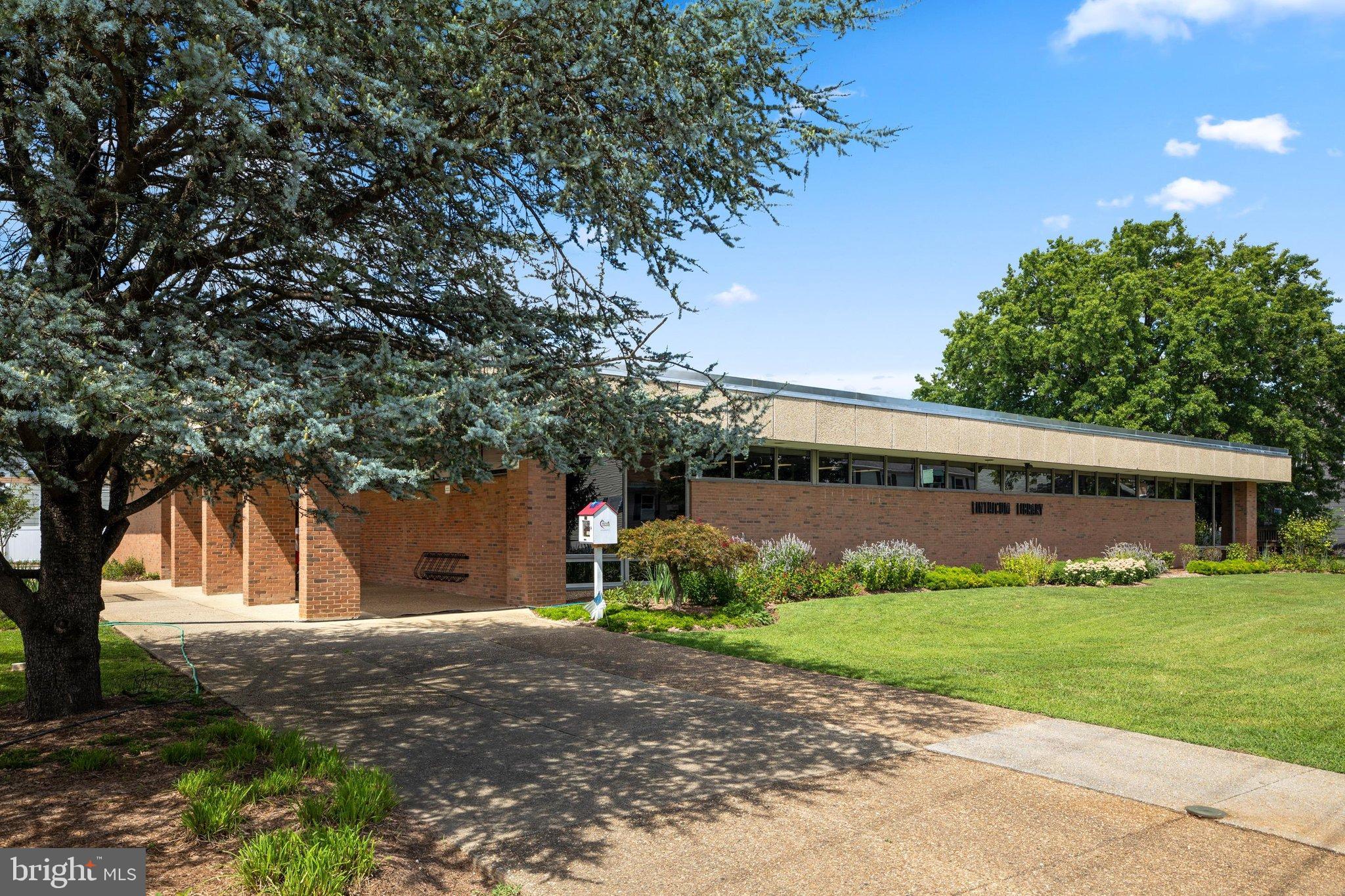 522 Old Hammonds Ferry Road Linthicum Heights, MD 21090 - Photo 84 of 109 Modern library nestled in lush greenery.