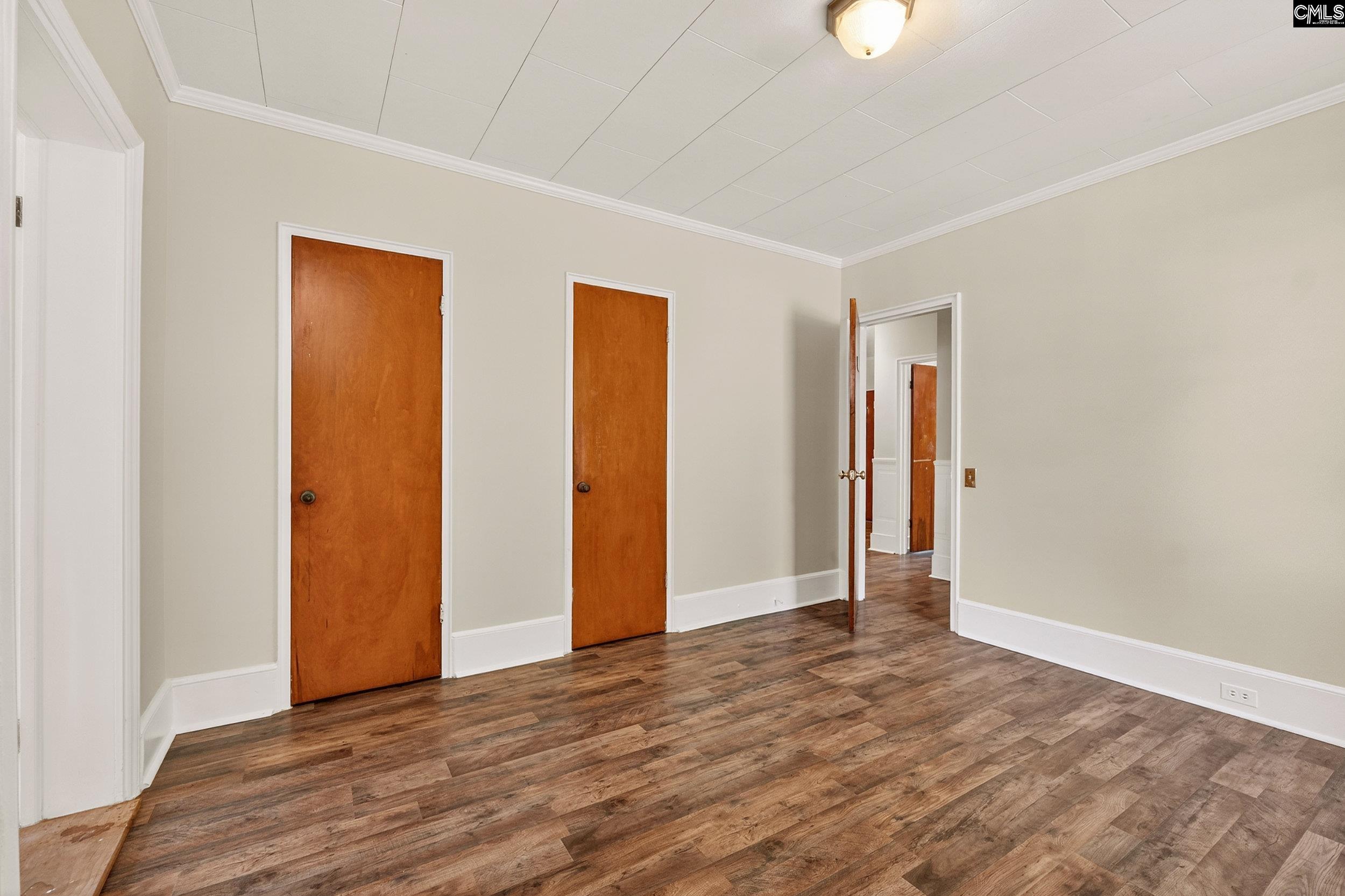 729 Magnolia Street Pelion, SC 29123 - Photo 16 of 32 a view of an empty room with wooden floor