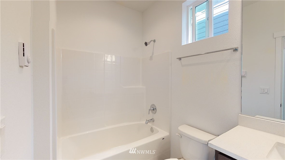 320 South 48th Street, Unit H19 Renton, WA 98055 - Photo 14 of 29 a bathroom with a bathtub and a toilet