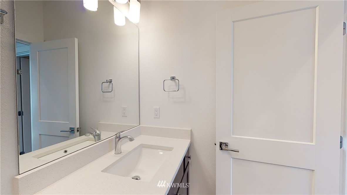 320 South 48th Street, Unit H19 Renton, WA 98055 - Photo 15 of 29 a bathroom with a sink mirror and shower