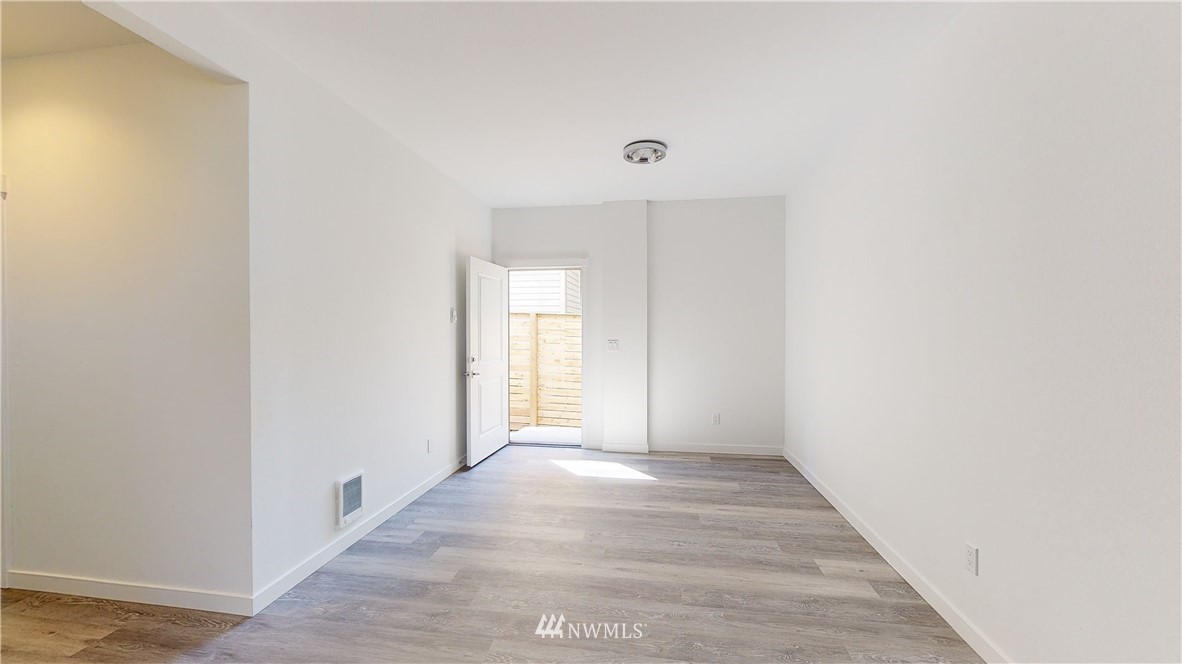 320 South 48th Street, Unit H19 Renton, WA 98055 - Photo 16 of 29 a view of an empty room with wooden floor
