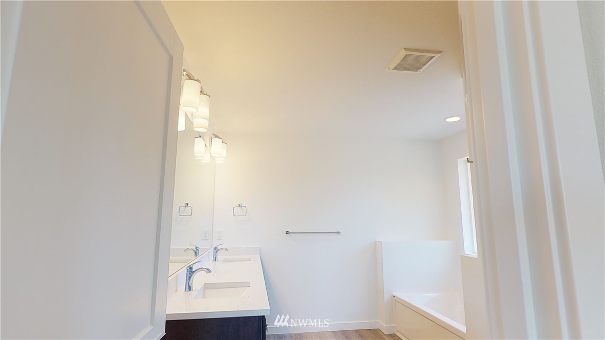 320 South 48th Street, Unit H19 Renton, WA 98055 - Photo 17 of 29 a bathroom with a sink and a mirror