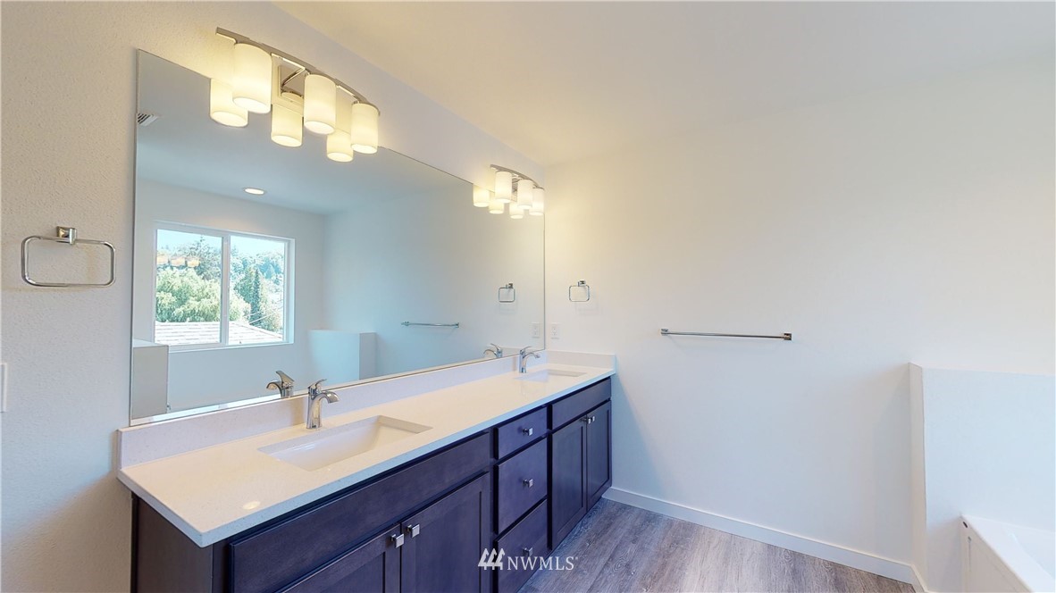 320 South 48th Street, Unit H19 Renton, WA 98055 - Photo 18 of 29 a bathroom with a sink vanity granite and a mirror