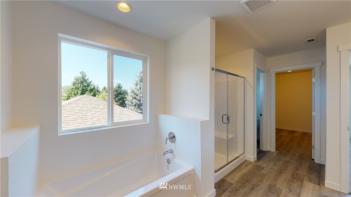 320 South 48th Street, Unit H19 Renton, WA 98055 - Photo 19 of 29 a view of a bathroom with a bathtub and a shower