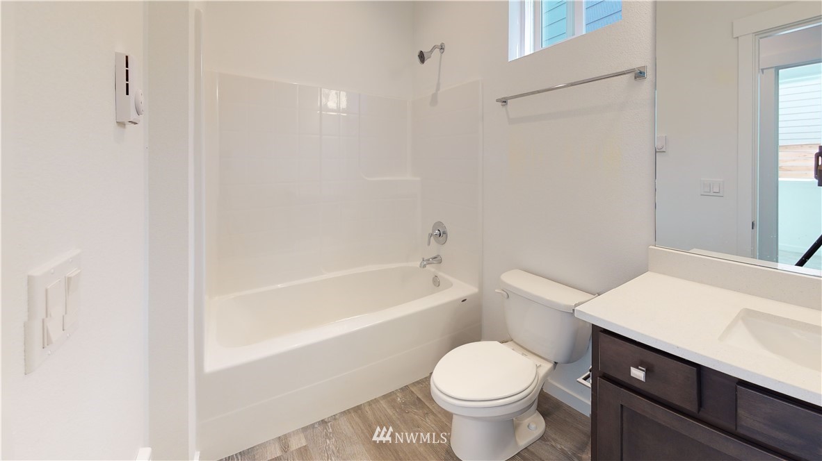 320 South 48th Street, Unit H19 Renton, WA 98055 - Photo 24 of 29 a bathroom with a sink toilet vanity and bathtub
